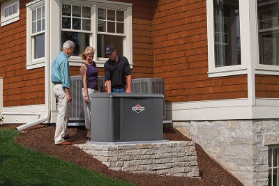 Homeowners Inspect a Briggs and Stratton Standby Generator After Installation.